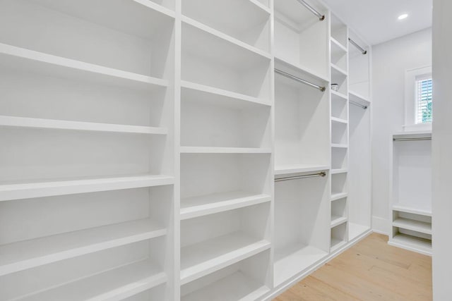 walk in closet featuring wood finished floors
