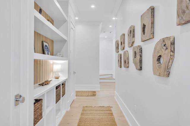 hallway featuring light wood finished floors, recessed lighting, and baseboards