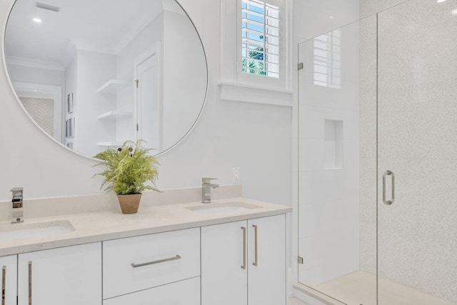 full bathroom with a shower stall, ornamental molding, and double vanity