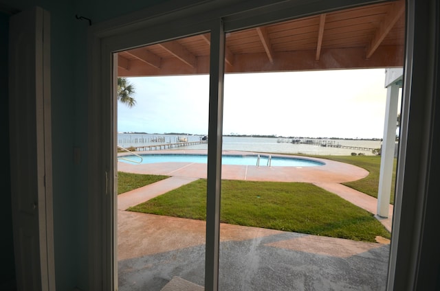 entryway featuring a water view and beam ceiling