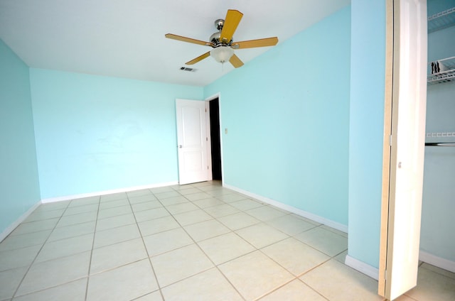 unfurnished bedroom with baseboards, visible vents, a closet, and light tile patterned flooring