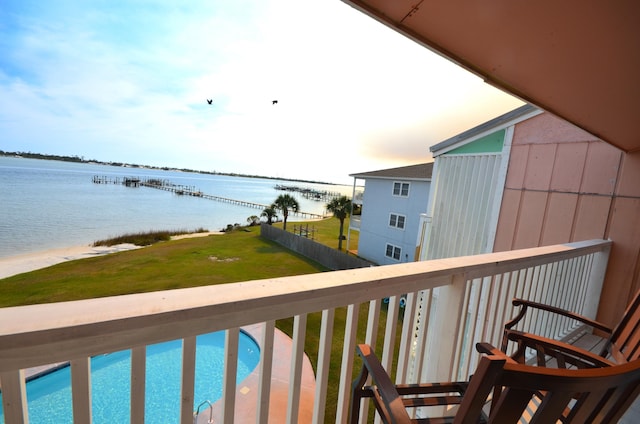 balcony featuring a water view