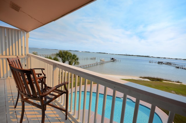 balcony featuring a water view