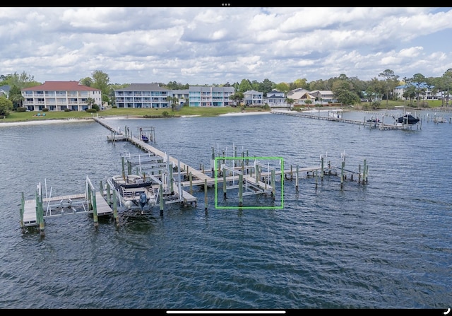 view of dock featuring boat lift and a water view
