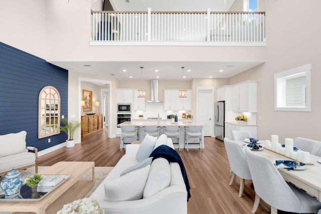 1760 Pathways Dr, Inlet Beach, FL 32461 - living area featuring a high ceiling and light wood-style flooring