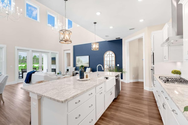 1760 Pathways Dr, Inlet Beach, FL 32461 - kitchen featuring a chandelier, wall chimney exhaust hood, a sink, stainless steel appliances, and a high ceiling