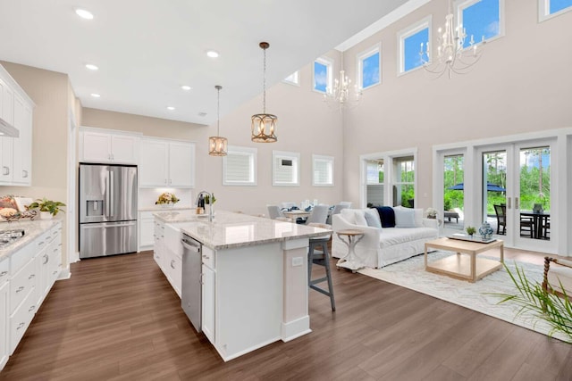 1760 Pathways Dr, Inlet Beach, FL 32461 - kitchen featuring appliances with stainless steel finishes, a chandelier, dark wood-style floors, white cabinetry, and recessed lighting