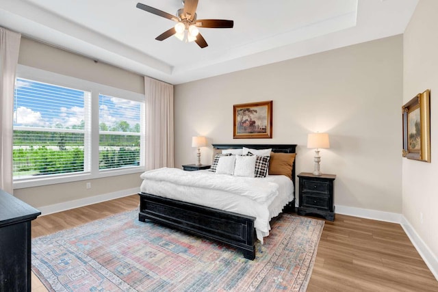 1760 Pathways Dr, Inlet Beach, FL 32461 - bedroom featuring multiple windows, light wood-style floors, and baseboards