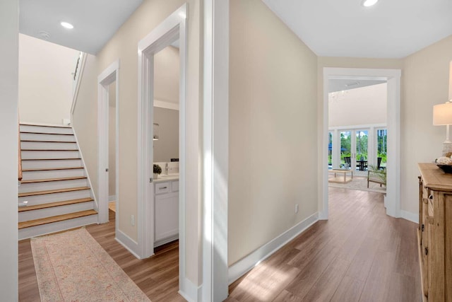 1760 Pathways Dr, Inlet Beach, FL 32461 - hall featuring light wood-style floors, stairs, baseboards, recessed lighting, and french doors