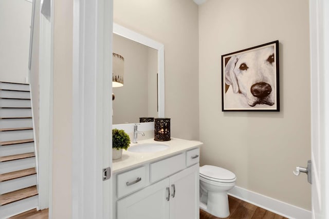 1760 Pathways Dr, Inlet Beach, FL 32461 - half bathroom with vanity, wood finished floors, toilet, and baseboards