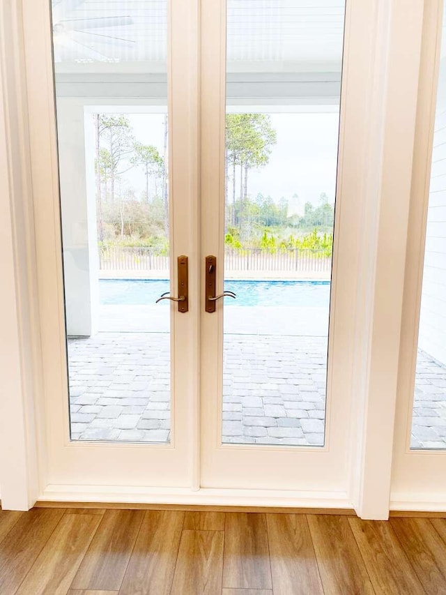 1760 Pathways Dr, Inlet Beach, FL 32461 - doorway with french doors and wood finished floors