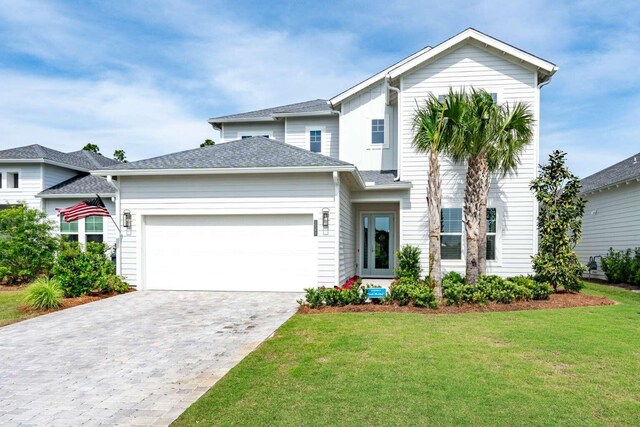1760 Pathways Dr, Inlet Beach, FL 32461 - view of front facade with a front yard, an attached garage, and decorative driveway