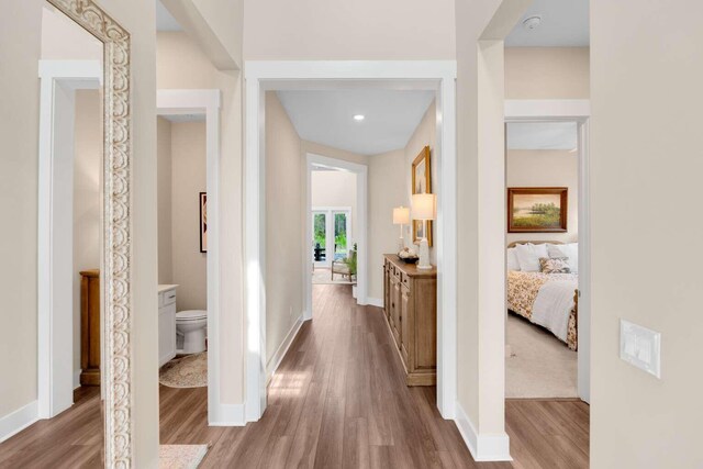 1760 Pathways Dr, Inlet Beach, FL 32461 - hallway with wood finished floors and baseboards