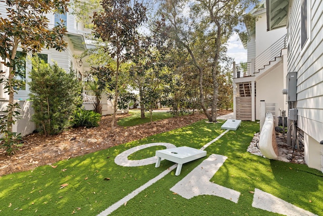 view of yard featuring stairway