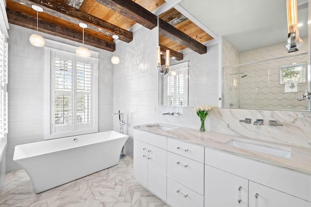 bathroom featuring a freestanding tub, plenty of natural light, tile walls, and a stall shower