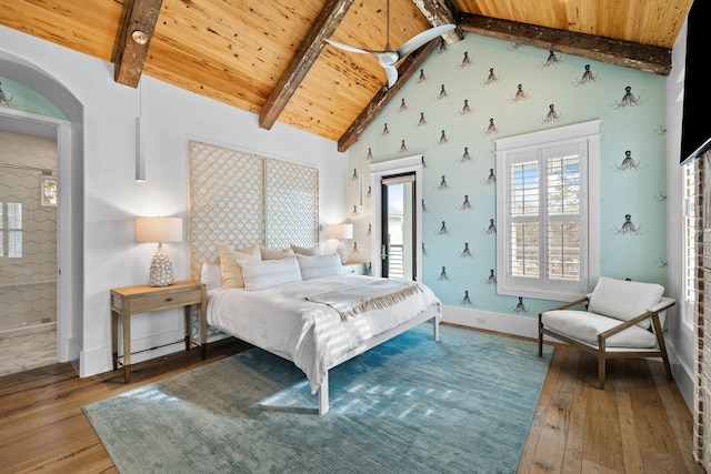 bedroom with wooden ceiling, wood finished floors, beam ceiling, and baseboards