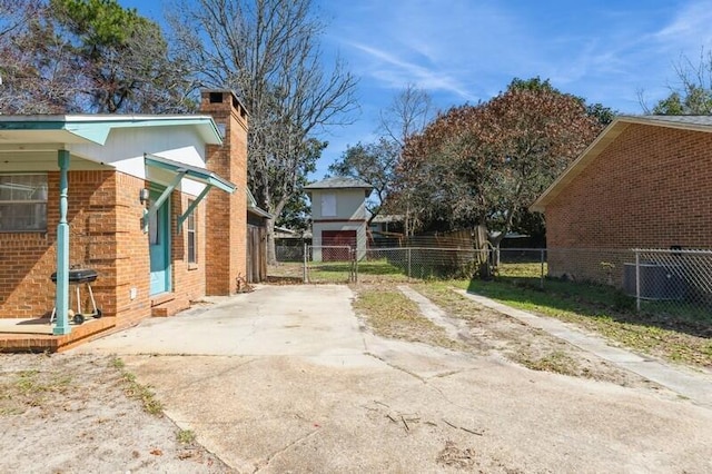 view of yard featuring central AC unit and fence