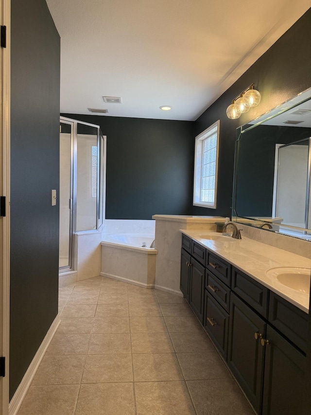 full bath with a garden tub, double vanity, tile patterned flooring, and a sink