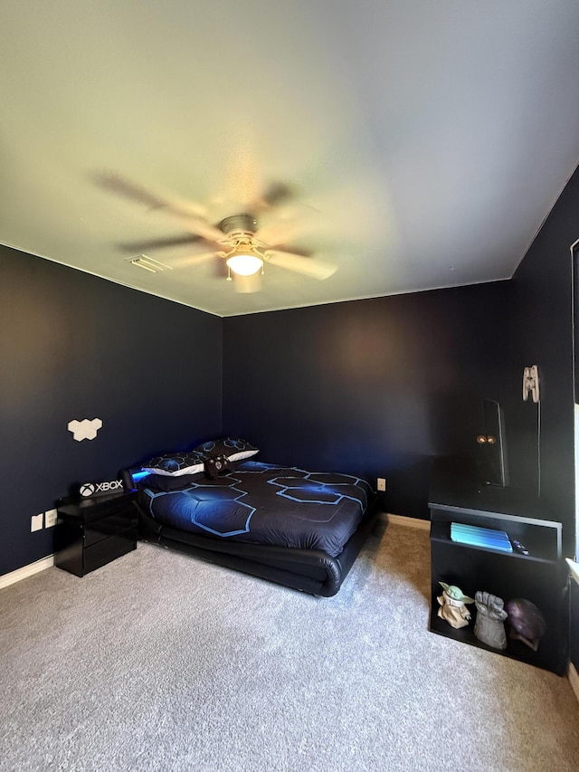 bedroom with baseboards, a ceiling fan, and carpet flooring