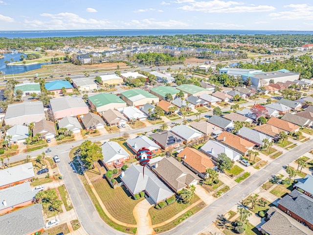 birds eye view of property featuring a residential view and a water view