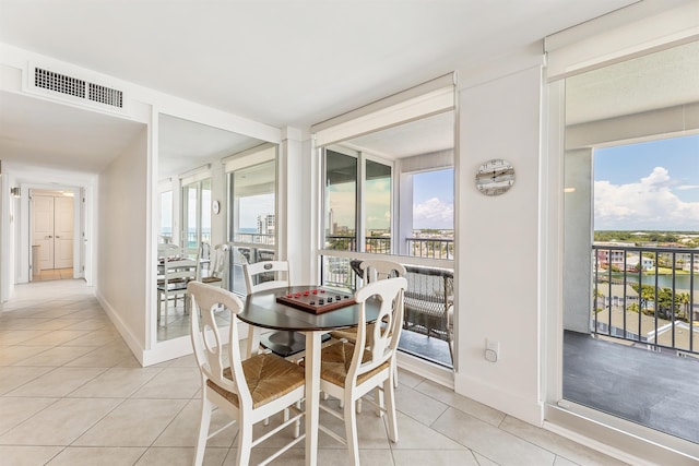 dining room with visible vents, baseboards, and light tile patterned floors