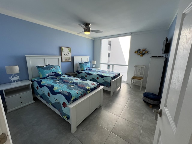 bedroom with light tile patterned flooring, a ceiling fan, and crown molding