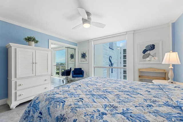 bedroom with tile patterned flooring, a closet, and ceiling fan