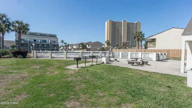 view of yard with fence and a patio