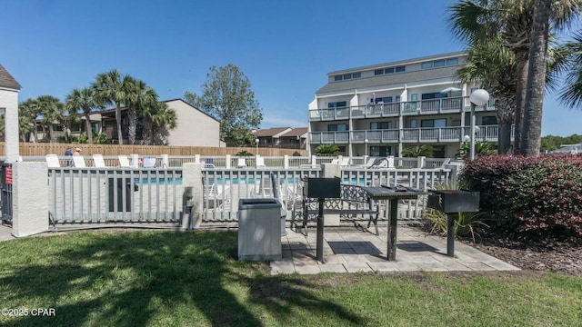 exterior space with a yard and fence