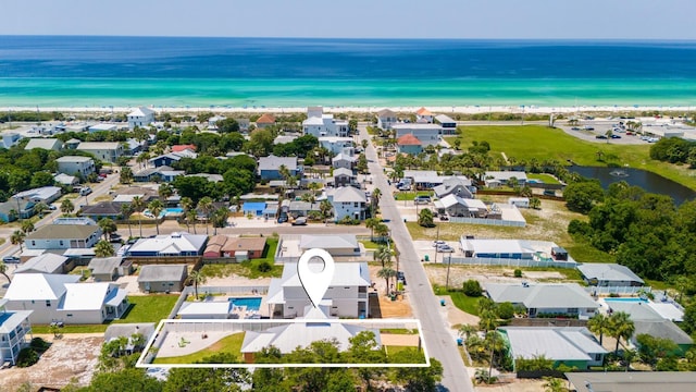 birds eye view of property with a water view and a residential view