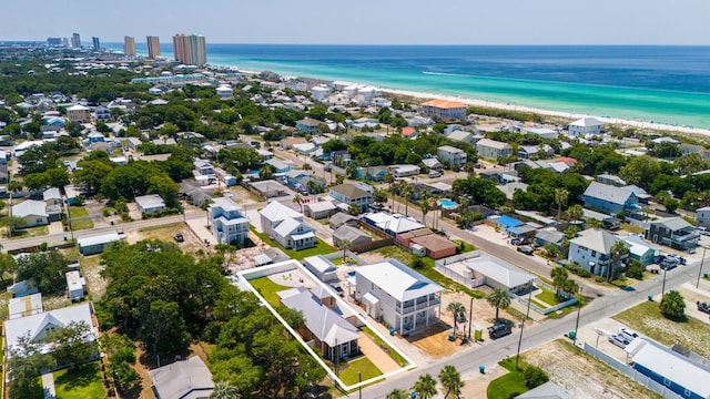 bird's eye view featuring a water view, a residential view, and a beach view