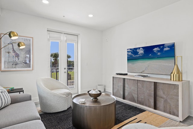 living area featuring french doors, recessed lighting, wood finished floors, and baseboards