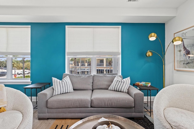 living room featuring wood finished floors and baseboards