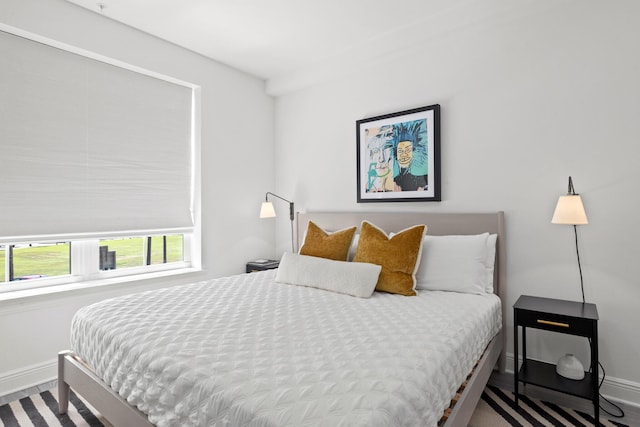 bedroom featuring baseboards