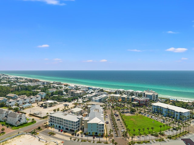 aerial view featuring a beach view, a water view, and a city view