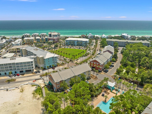 drone / aerial view featuring a water view and a view of city