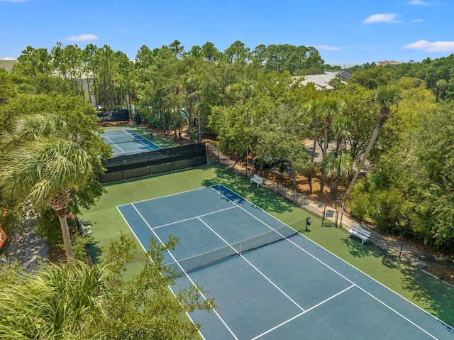 view of tennis court with fence