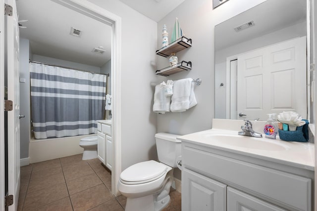 full bathroom featuring toilet, tile patterned flooring, visible vents, and vanity