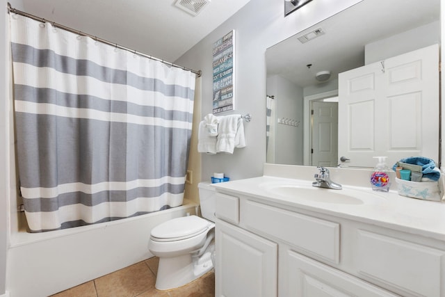 full bath featuring vanity, visible vents, shower / bath combo with shower curtain, and tile patterned floors