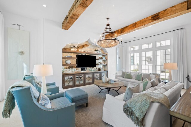 living area featuring recessed lighting, beam ceiling, and an inviting chandelier