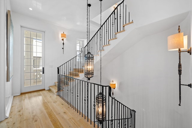 stairway featuring wood finished floors