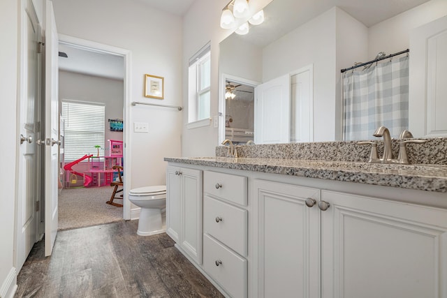 124 Conner Cir, Santa Rosa Beach, FL 32459 - full bath with toilet, ceiling fan, wood finished floors, curtained shower, and vanity