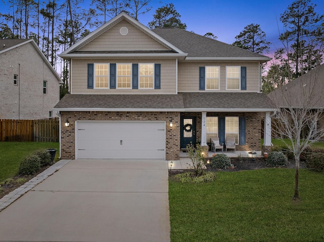 view of front of house with driveway, a front lawn, a shingled roof, and fence