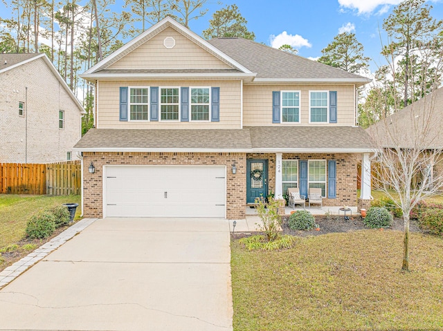 124 Conner Cir, Santa Rosa Beach, FL 32459 - view of front of home featuring a shingled roof, driveway, a front lawn, and fence
