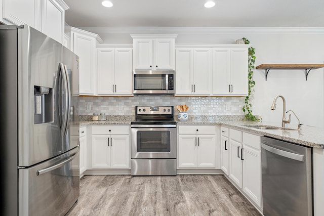 124 Conner Cir, Santa Rosa Beach, FL 32459 - kitchen with open shelves, appliances with stainless steel finishes, and white cabinets