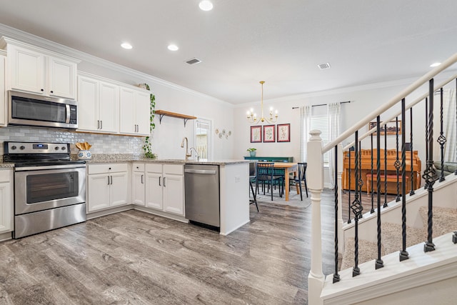 124 Conner Cir, Santa Rosa Beach, FL 32459 - kitchen featuring open shelves, white cabinetry, stainless steel appliances, and pendant lighting