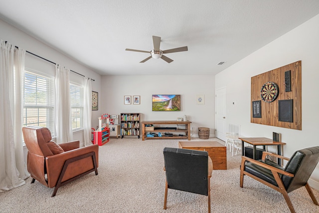 124 Conner Cir, Santa Rosa Beach, FL 32459 - living area featuring a textured ceiling, a ceiling fan, visible vents, and light colored carpet