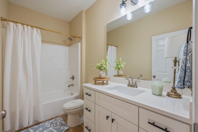 bathroom with toilet, vanity, and shower / tub combo with curtain