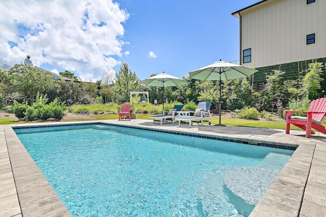 outdoor pool featuring a patio