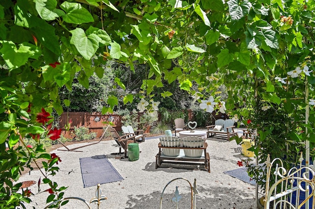 view of patio featuring fence